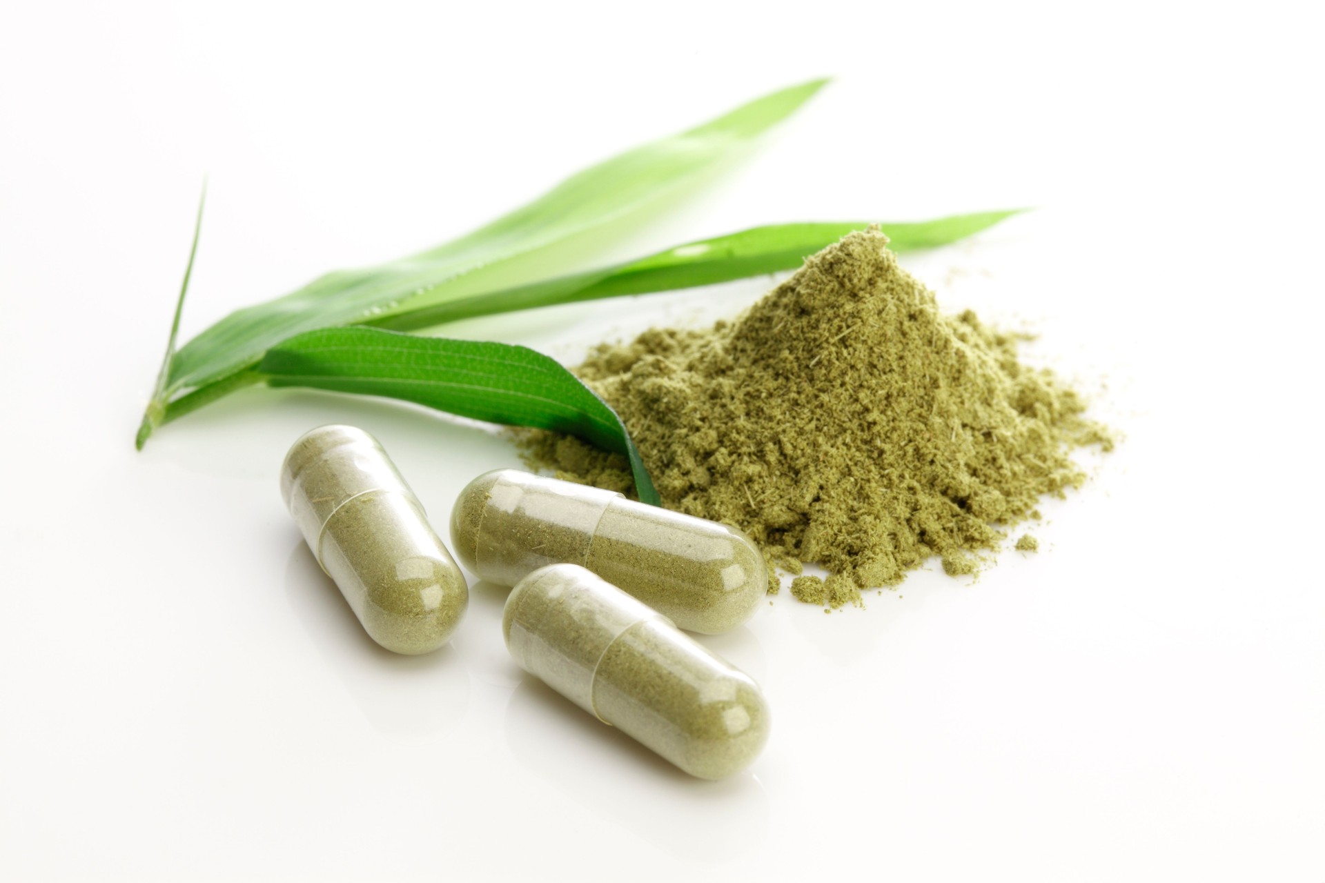 Herbal capsules on white